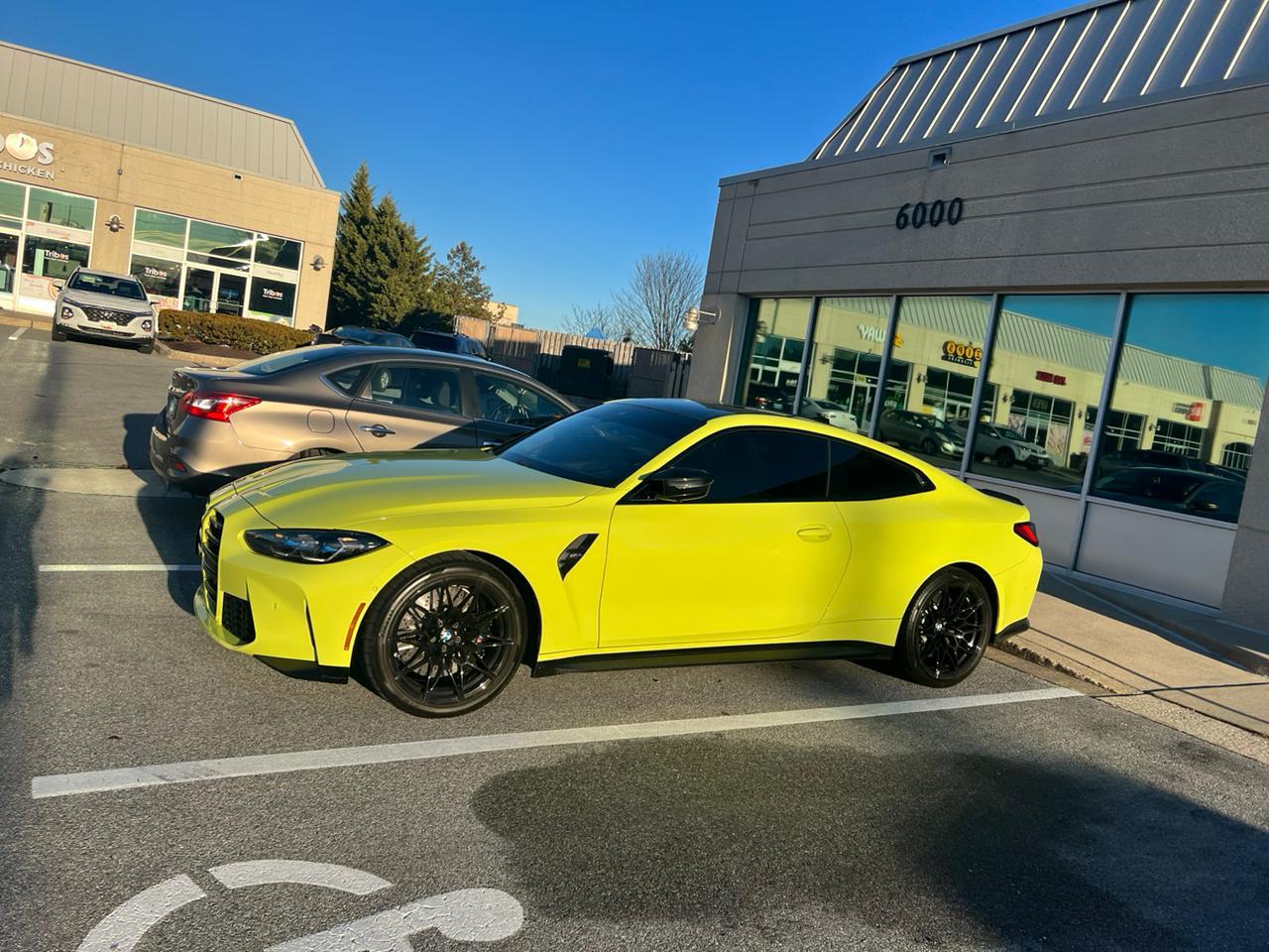 Yellow BMW after a complete detail